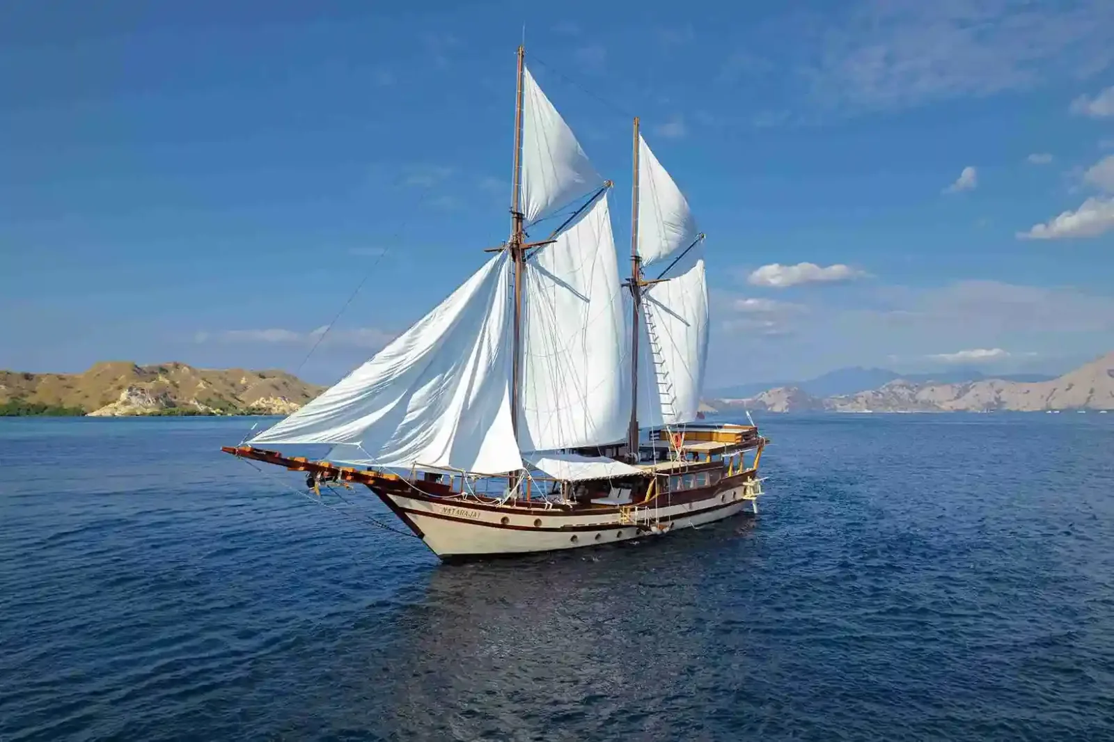 A phinisi under full sail