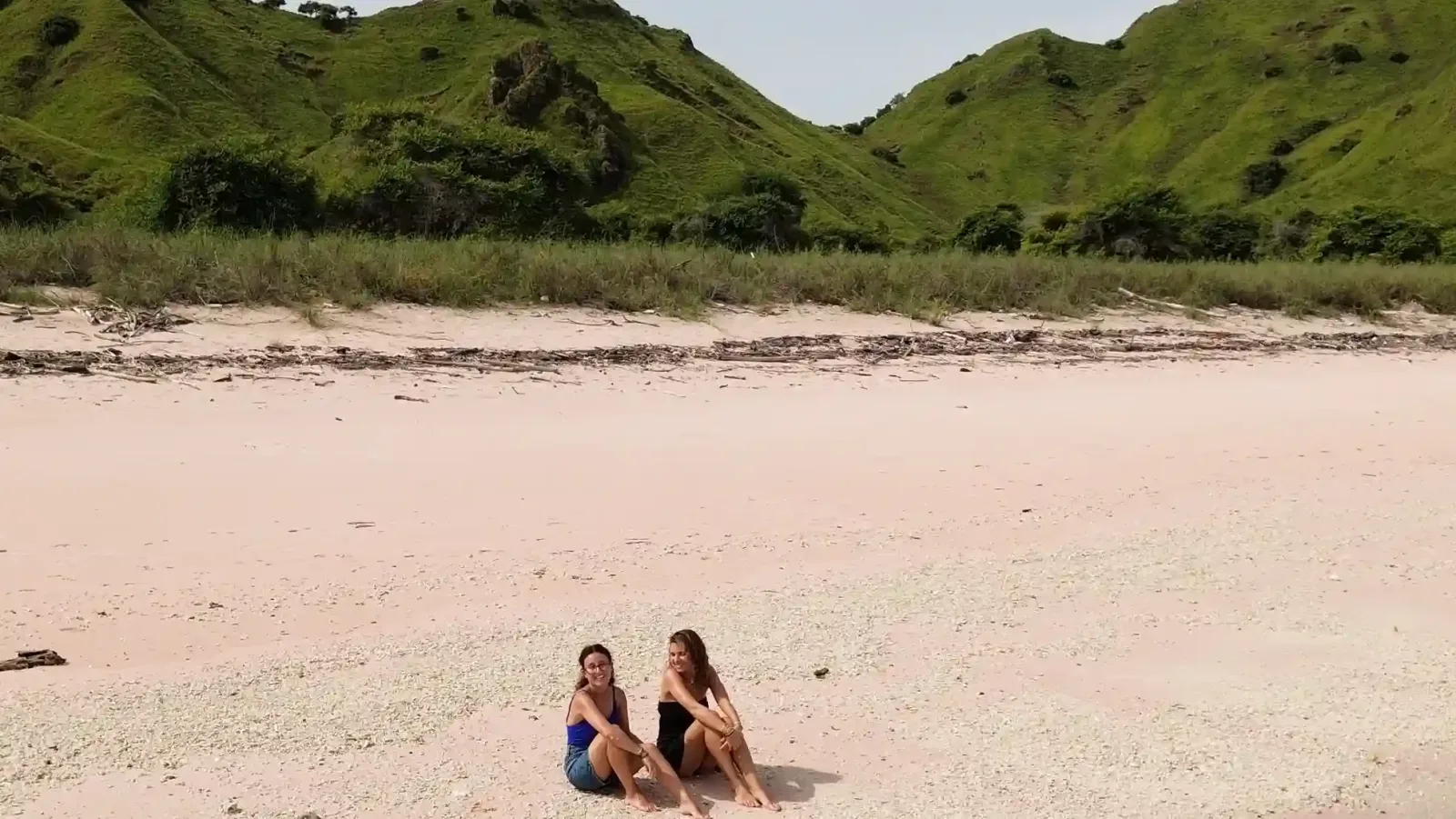 Guests on the sand at Pink Beach
