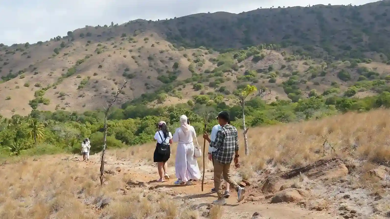 A ranger leading visitors along the Loh Buaya trek on Rinca Island